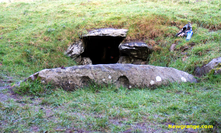 The entrance to Dowth passage and chamber lit up by the setting Winter Solstice sun.