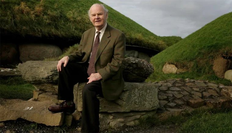 Prof George Eogan in front of the Neolithic passage mounds at Knowth