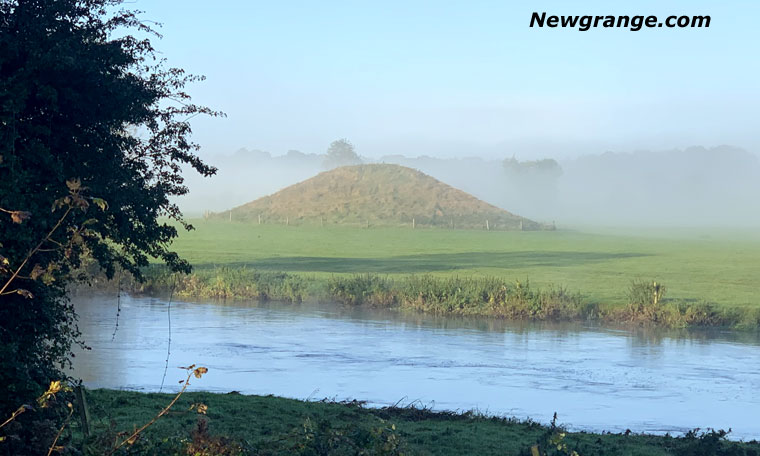 Newgrange Site B rising out of morning mist above the River Boyne.