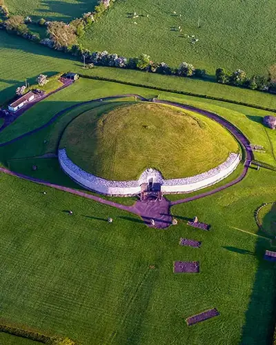 Aerial view of Newgrange and its distinctive white quartz façade in the Boyne Valley