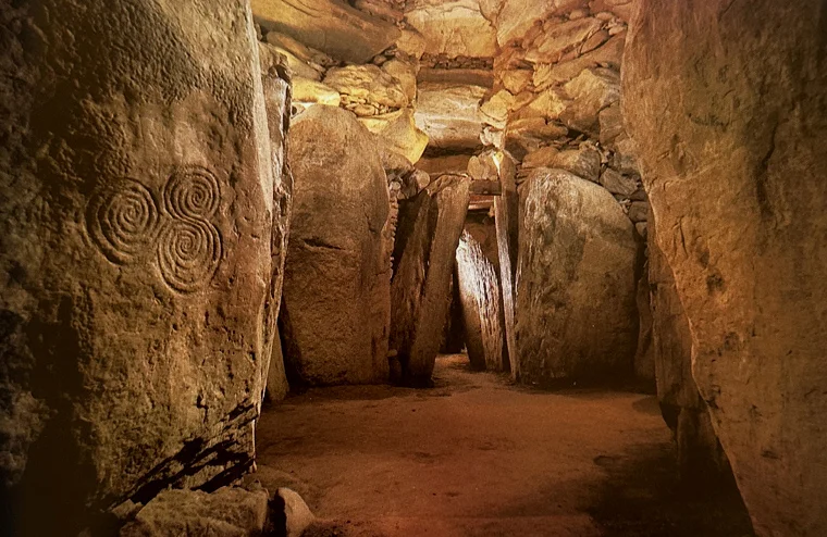 Newgrange chamber featuring the iconic triple spiral carving